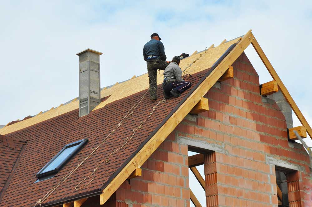 Roofing crew working on a residential roof near Centerville, Ohio